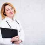 32028245-portrait-of-mature-female-doctor-or-nurse-holding